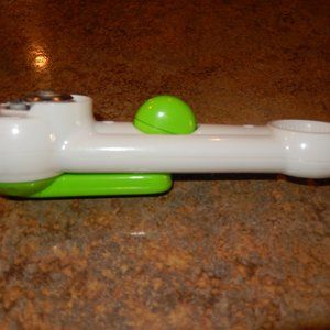 White and Green Can Opener